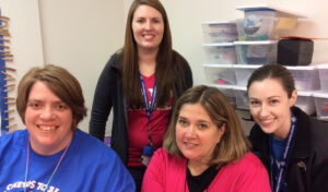 Tracy Niccum with other special education teachers smiling